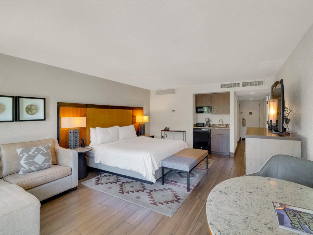 King bedroom in Camelback Inn Unit 568 with sleeper sofa and in-room wet bar