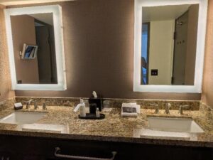 Double granite vanity bathroom in Unit 119 at Camelback Inn in Scottsdale, Arizona.Double granite vanity with updated fixtures and generous counter space.